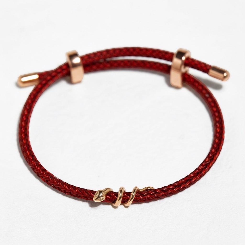 BoxUnboxed 18k solid gold snake bracelet with diamond on red string cord. Adjustable fit.