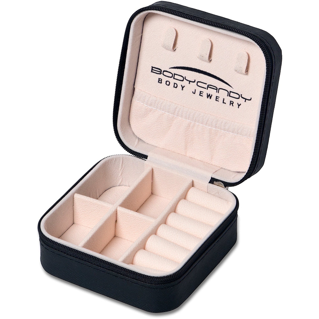 BoxUnboxed black travel jewelry box organizer with soft pink interior, ring rolls, and compartments.