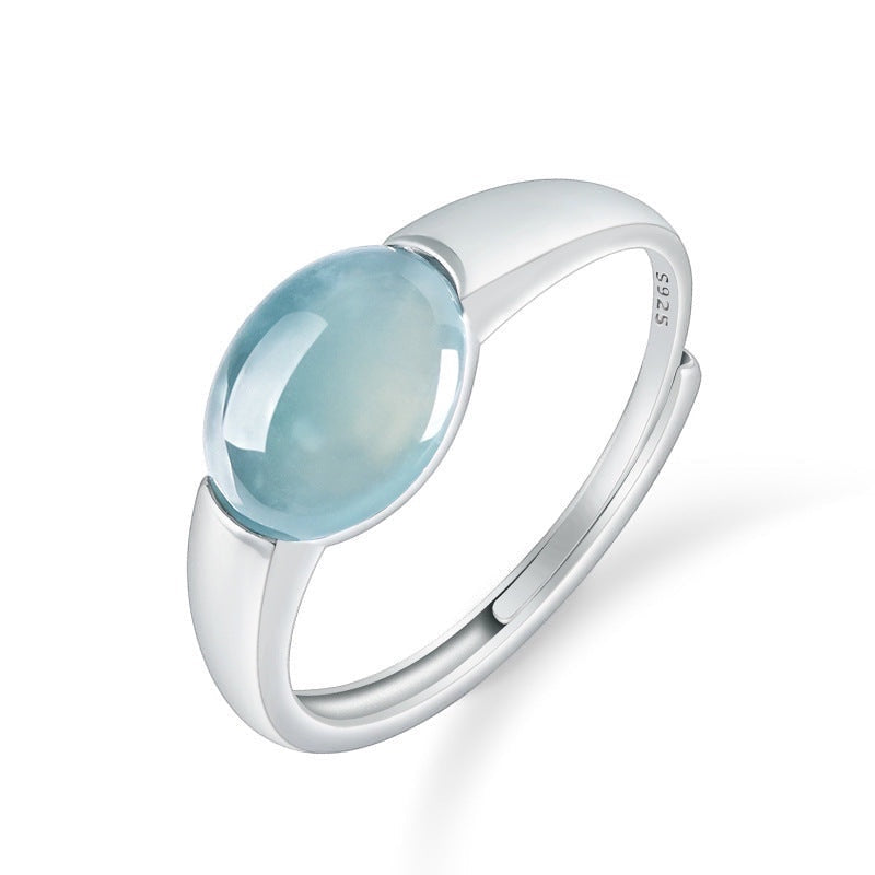 BoxUnboxed Aurora ring with a smooth, oval, icy teal-blue jadeite stone in a platinum-plated sterling silver adjustable band.
