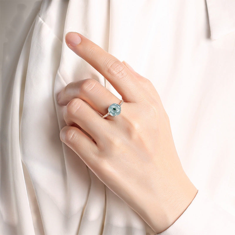 BoxUnboxed adjustable ring featuring a natural blue water jadeite peach blossom stone on a platinum-plated silver band.