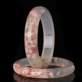 BoxUnboxed Natural Flower Agate Sakura Bangles with delicate pink floral inclusions, polished smooth stone.