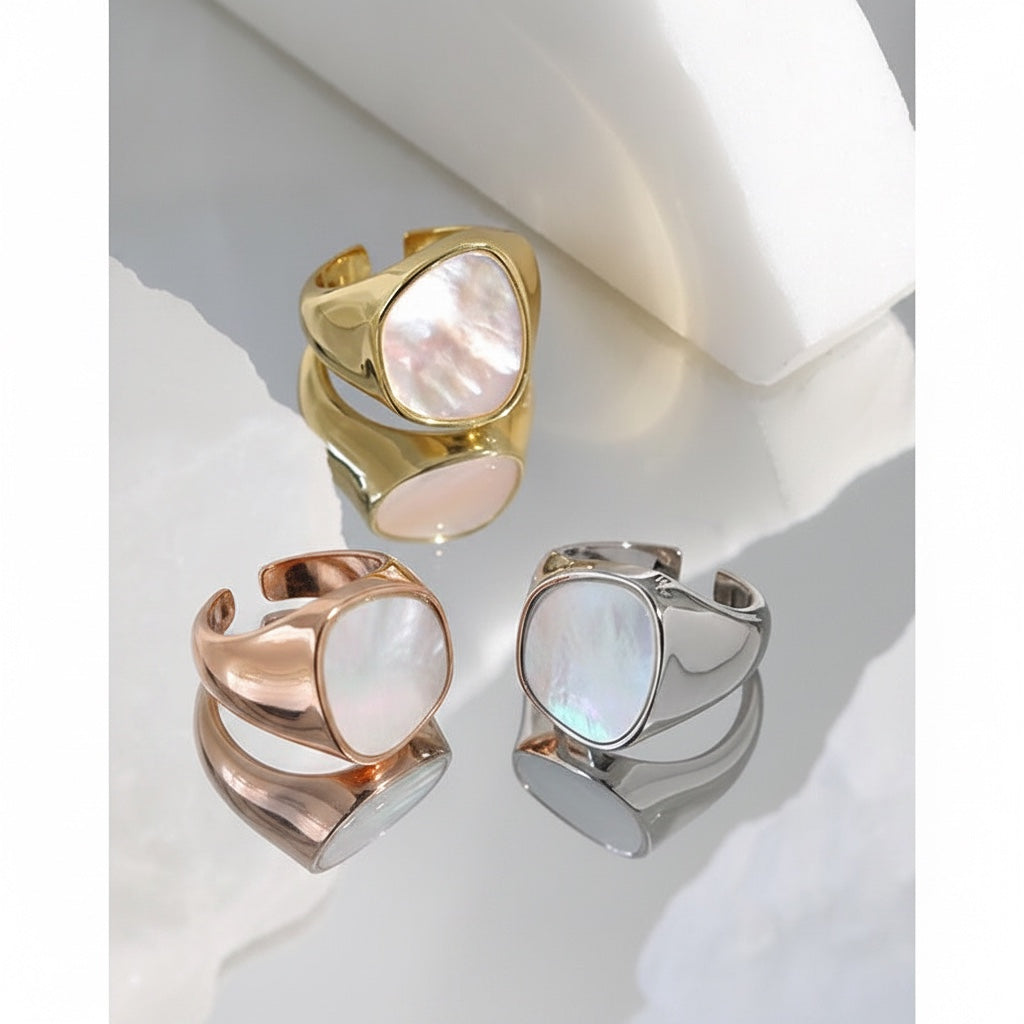 BoxUnboxed Iris geometric statement ring in sterling silver with pearlescent inlay. Gold version also shown.