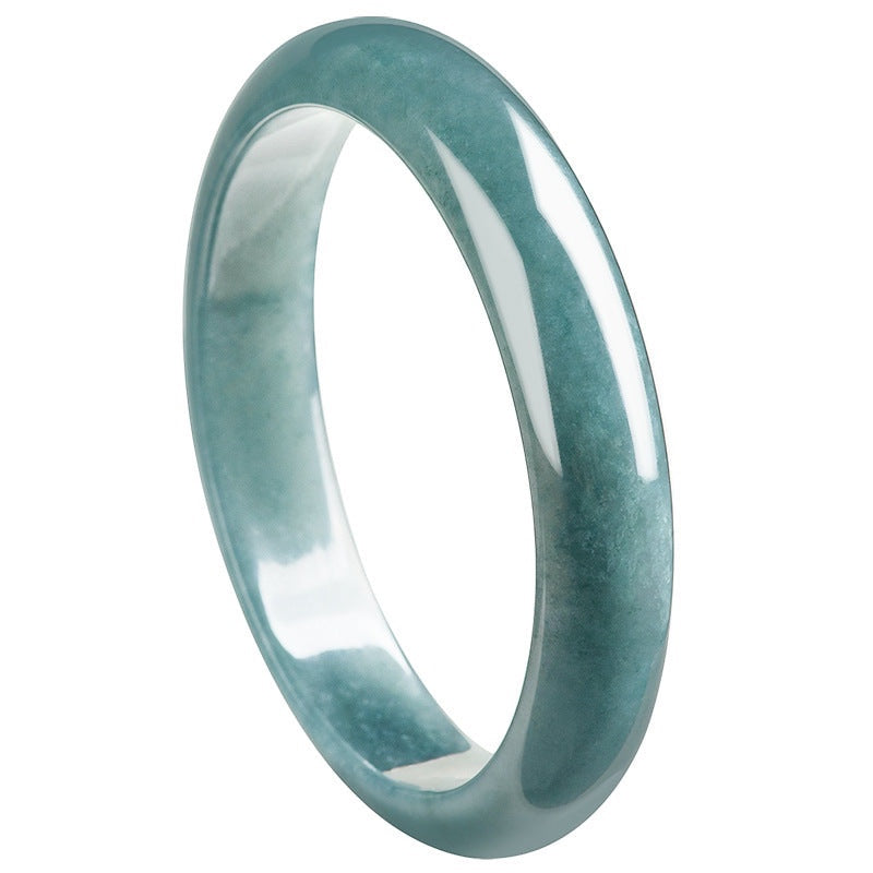 BoxUnboxed Meridian Natural Blue Water Jadeite Bangle, a translucent ocean-teal, smooth, rounded, unisex bracelet.